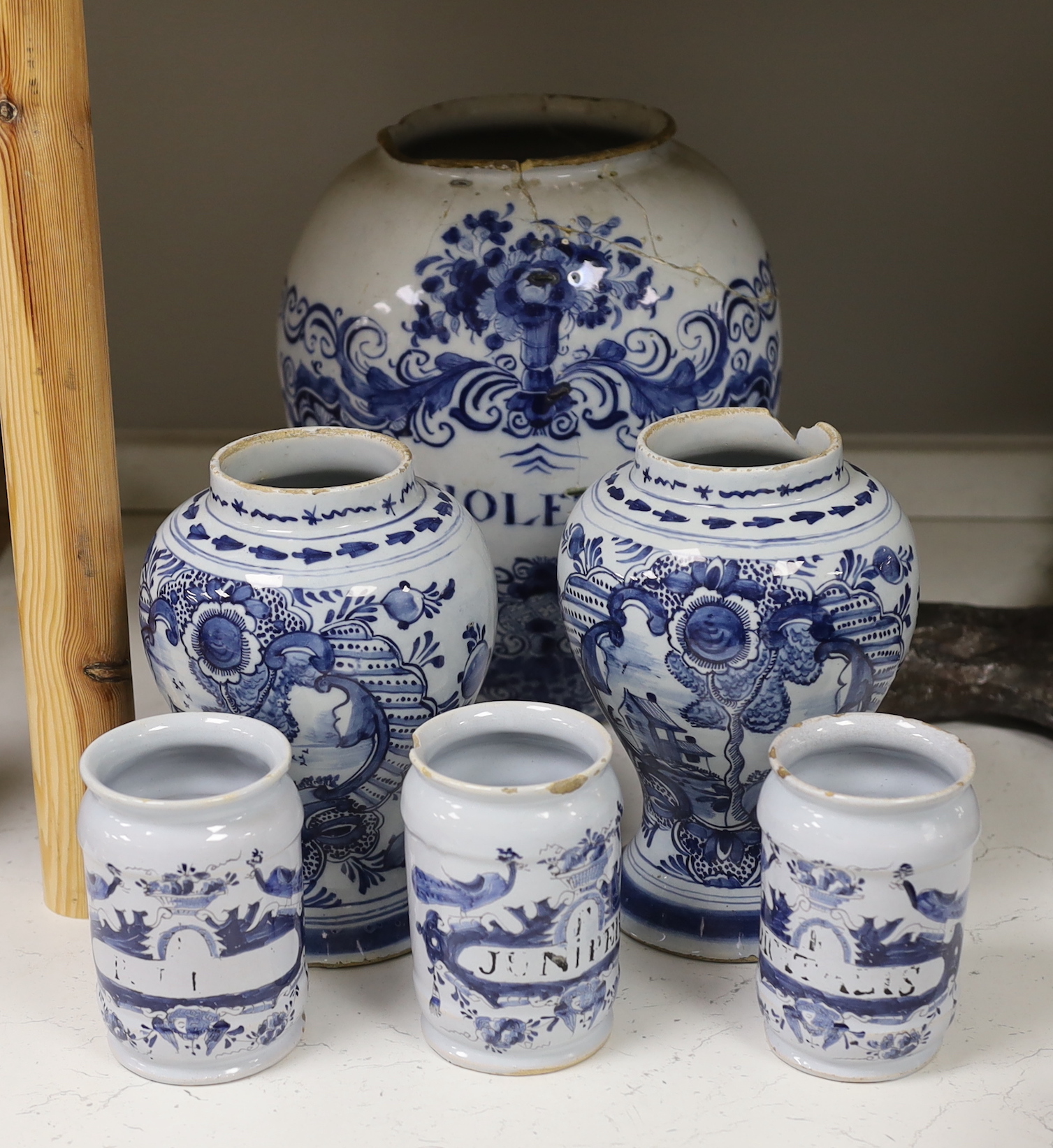 A set of three 18th century Delft drug jars, a similar large Violetta jar, Duyn mark, and a pair of 18th century Delft vases, tallest 28cm high